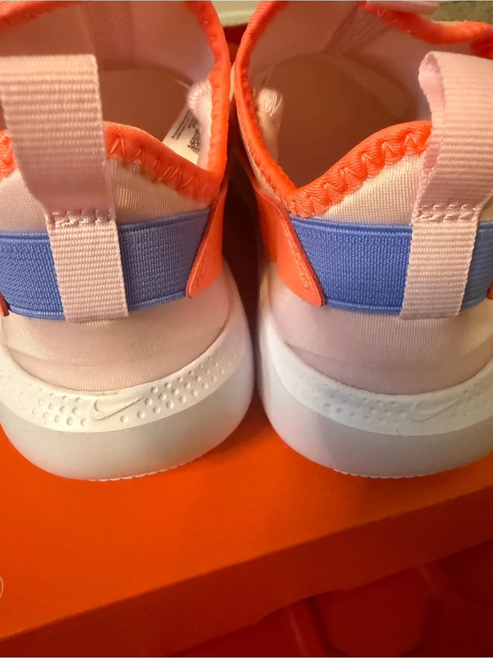 Nike Kids Slip-On Sneakers in white Orange & Purple Accents